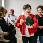 group of students talking at a staircase